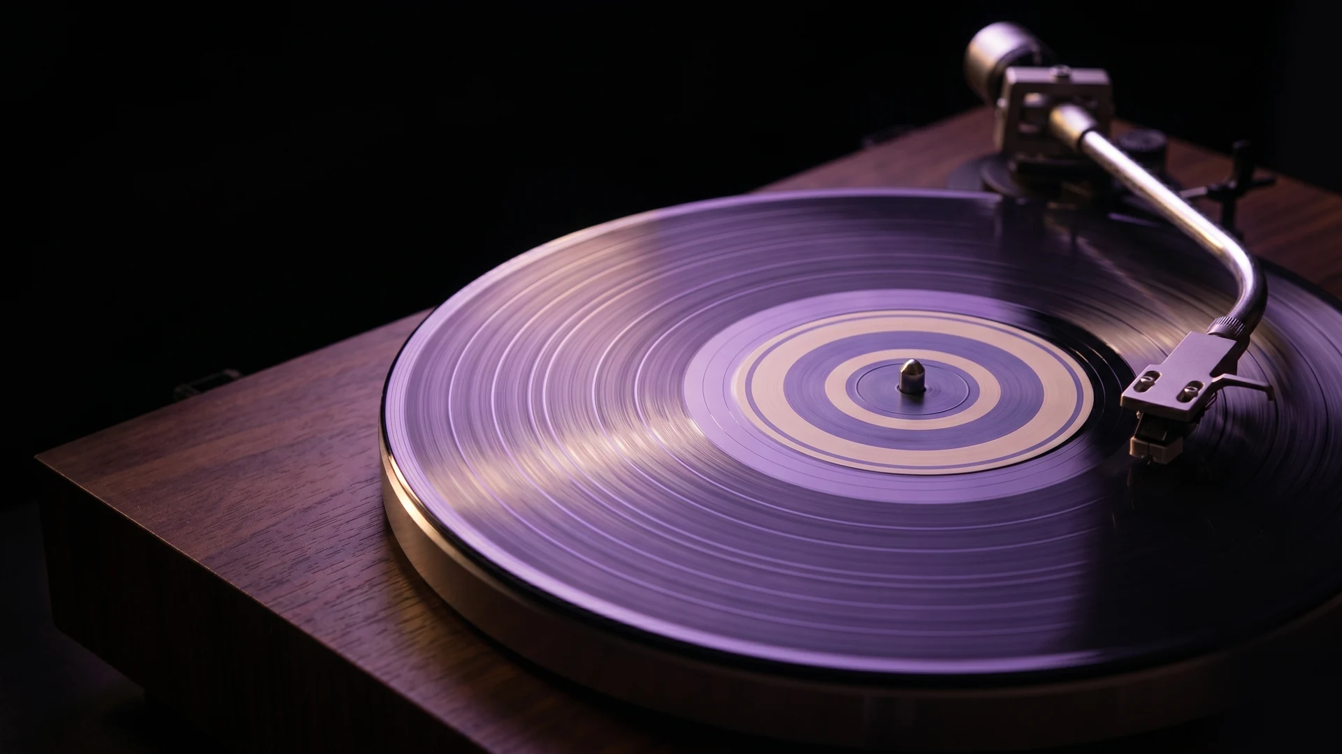 Vinyl record on a turntable — the finished release, the artist’s long-form artefact.
