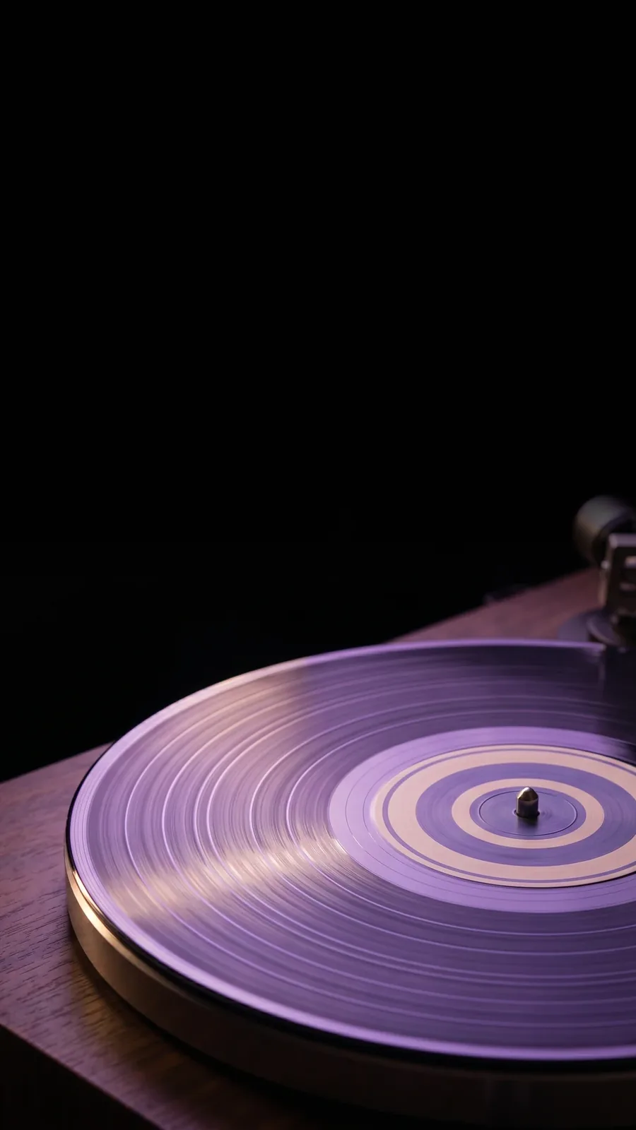 Vinyl record on a turntable — the finished release, the artist’s long-form artefact.